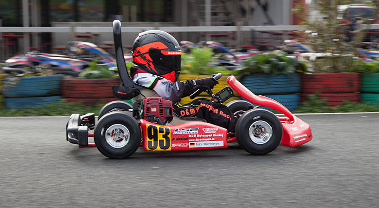 a child wearing kart racing gear, showing best kart racing accessories